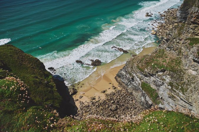 View from a cliff looking down on a small cove