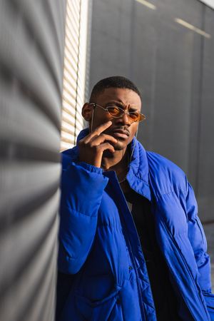 Stylish Black man in sunglasses on street
