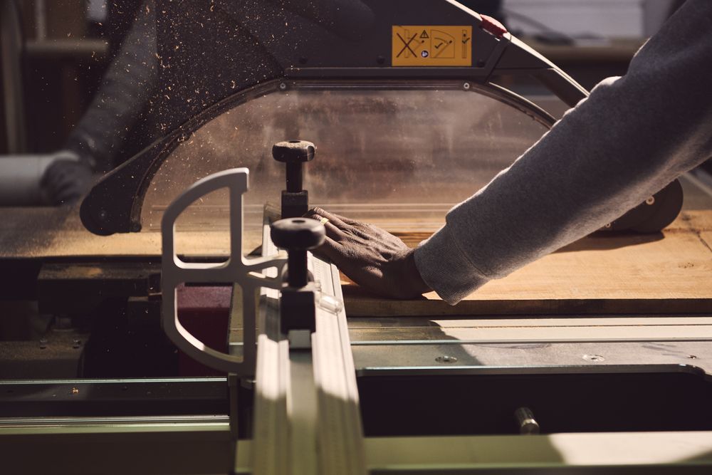 Man cutting wood at a carving machine