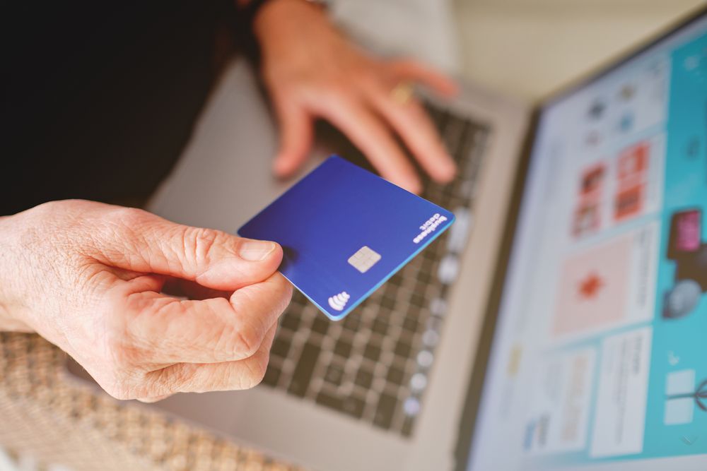 Shopping with business debit card on laptop