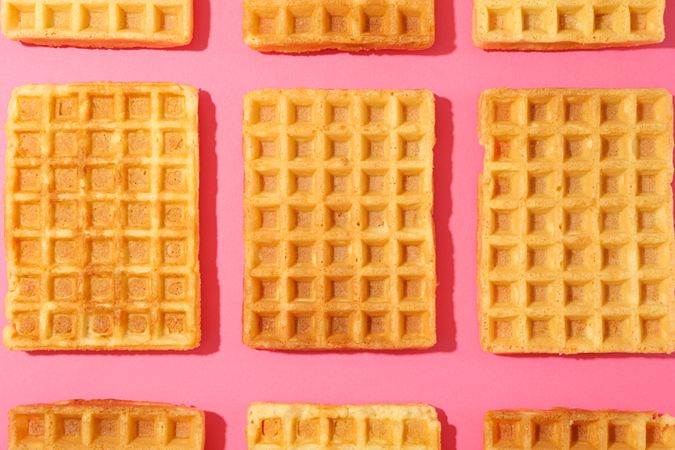 Flat lay composition with belgian waffles on color background