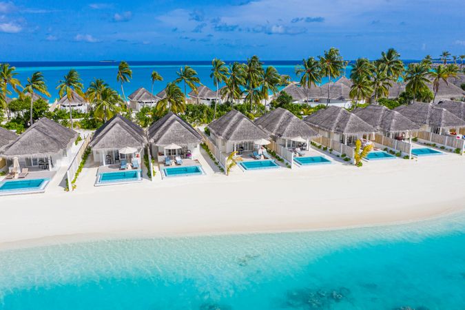 Holiday villas line the beach in the Maldives