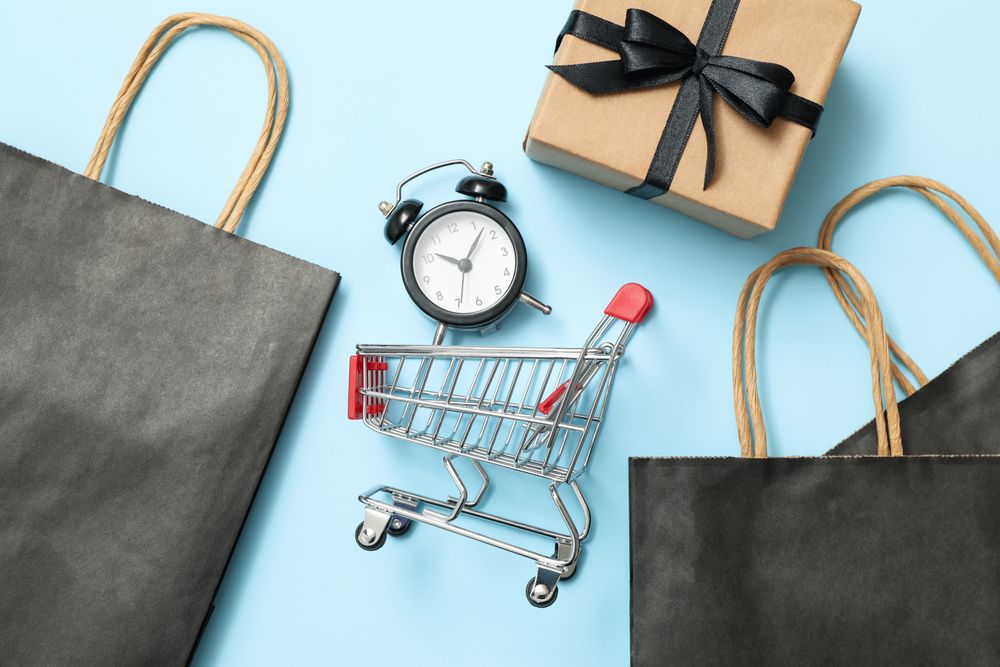 Sale concept with shop cart on blue background