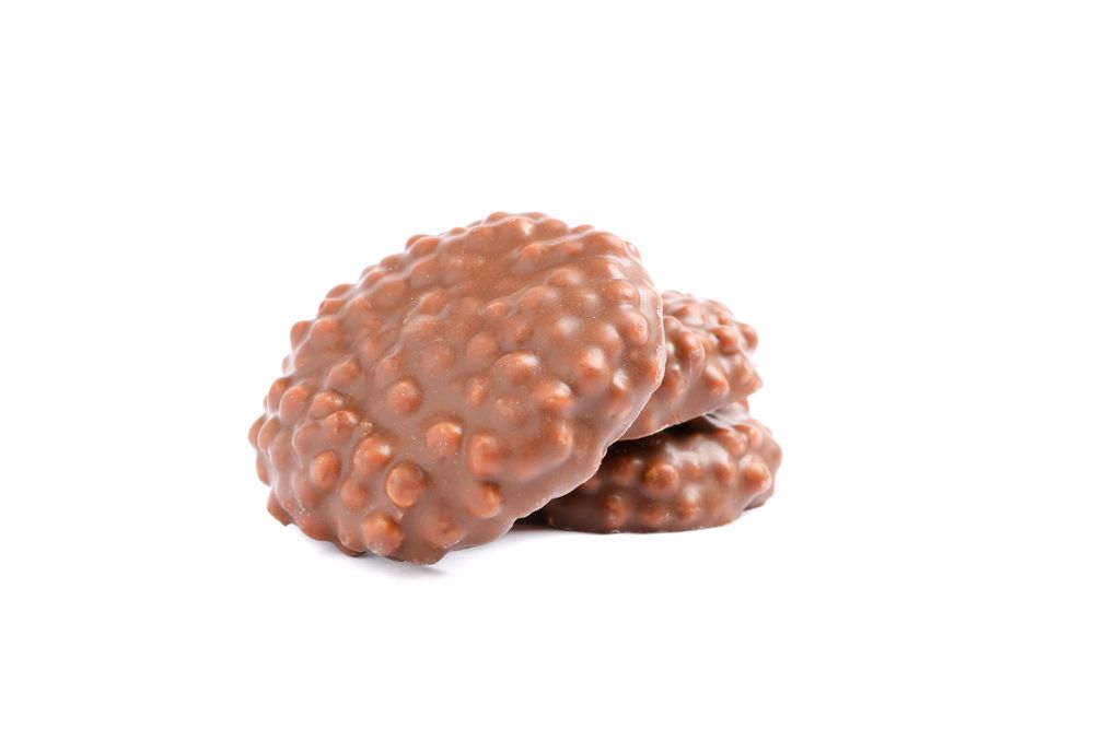 Chocolate cookies with caramel filling isolated on plain background