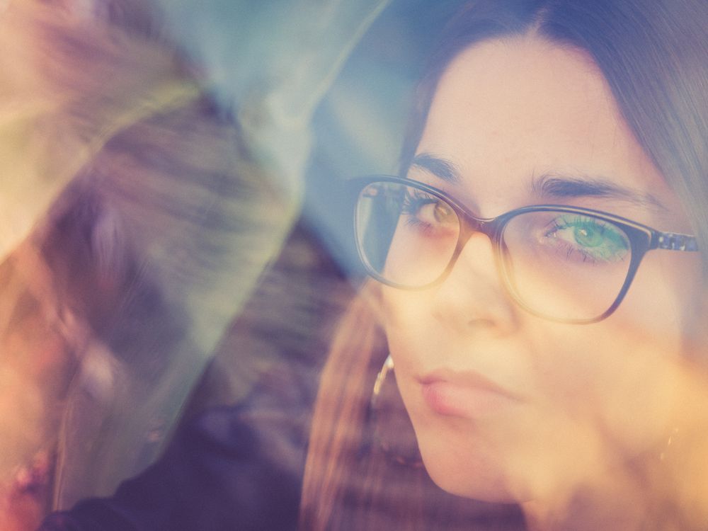 Woman in eyeglasses and earrings