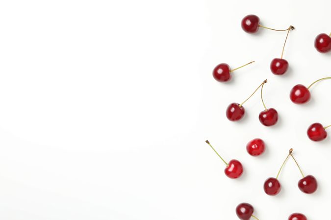 Ripe juicy cherry fruits on a light background