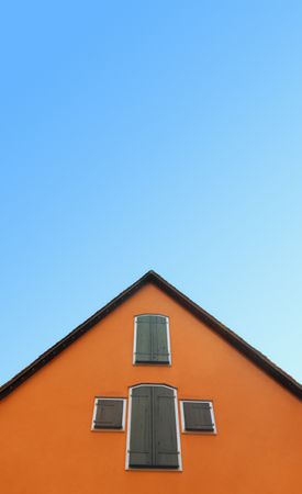 Orange house against blue sky