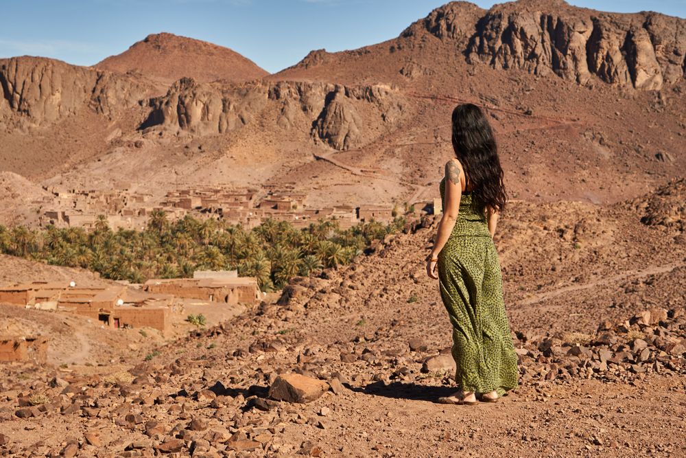 Woman between desert near mountains