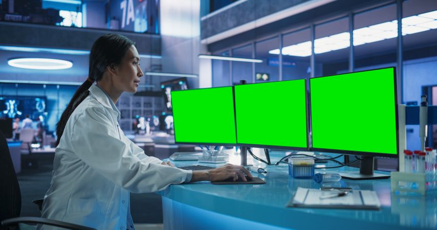 Hospital Research Laboratory: Asian Female Medical Scientist Using Computer Green Screen Chromakey On Display.