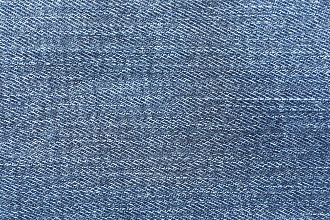 Texture of blue jeans as background, space for text