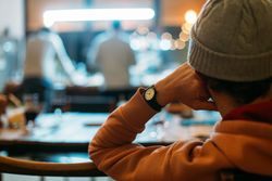 Rearshot of man looking over at kitchen