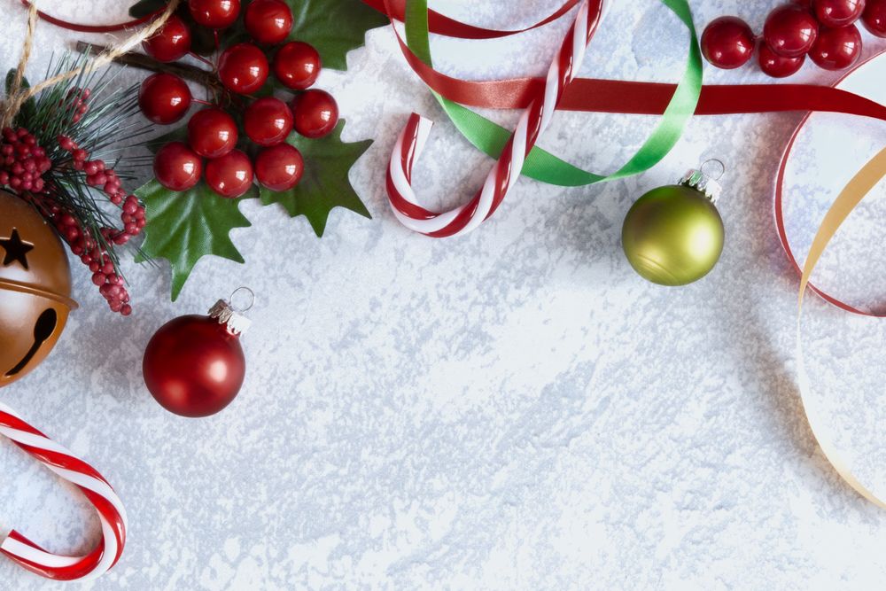 Christmas Background with Christmas decorations on a grey backdrop.