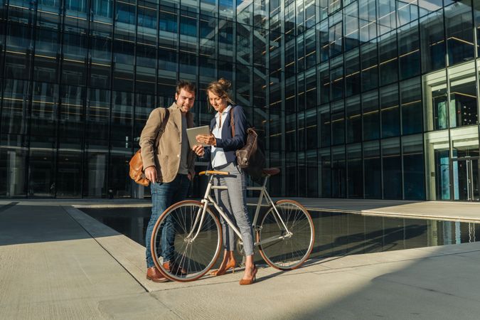 Businesspeople talking on street after work