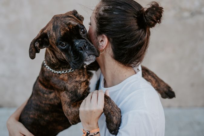 Young woman hugging with spot dog