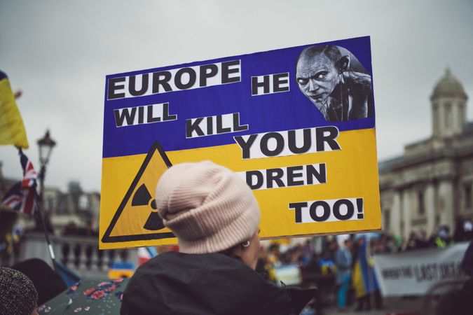 London, England, United Kingdom - March 5 2022: Woman with Ukrainian flag sign in Trafalgar Square