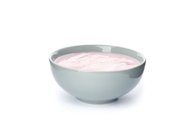 Bowl with fruit yogurt isolated on plain background