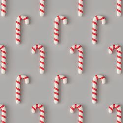 Holiday pattern with candy canes on gray background