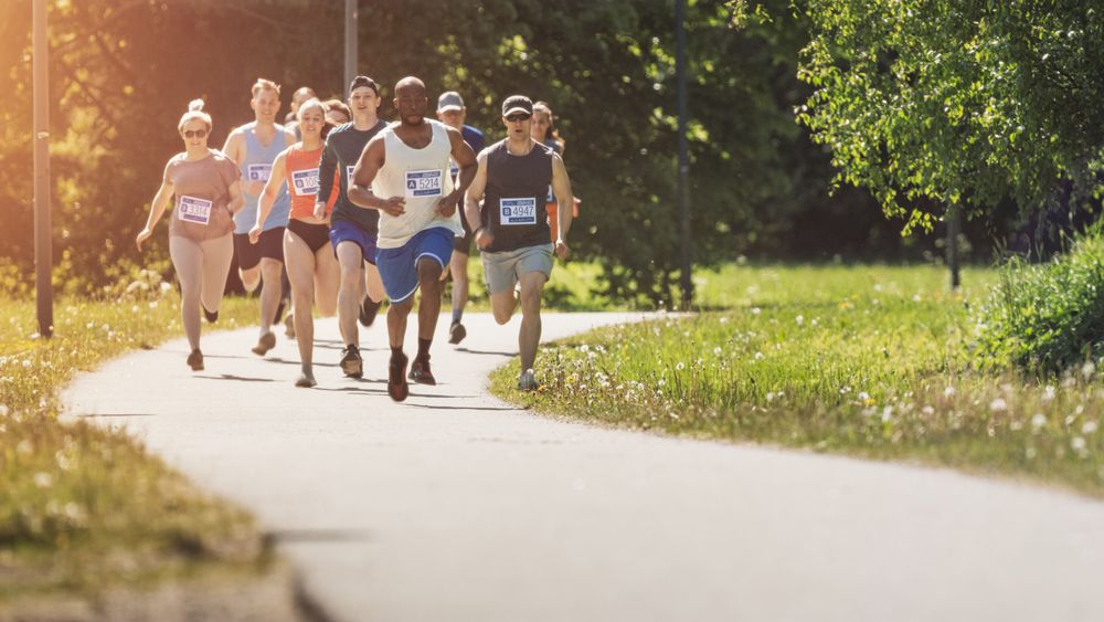 Wide Shot of Diverse Marathon Participants Competing in a Race for the Finish Line
