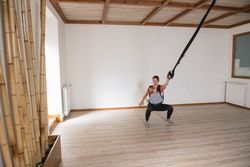 Mother exercising with baby in gym
