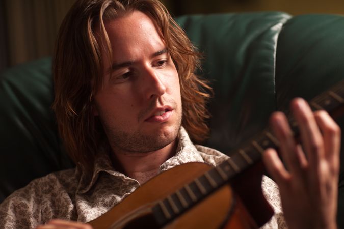 Young Musician Plays His Acoustic Guitar