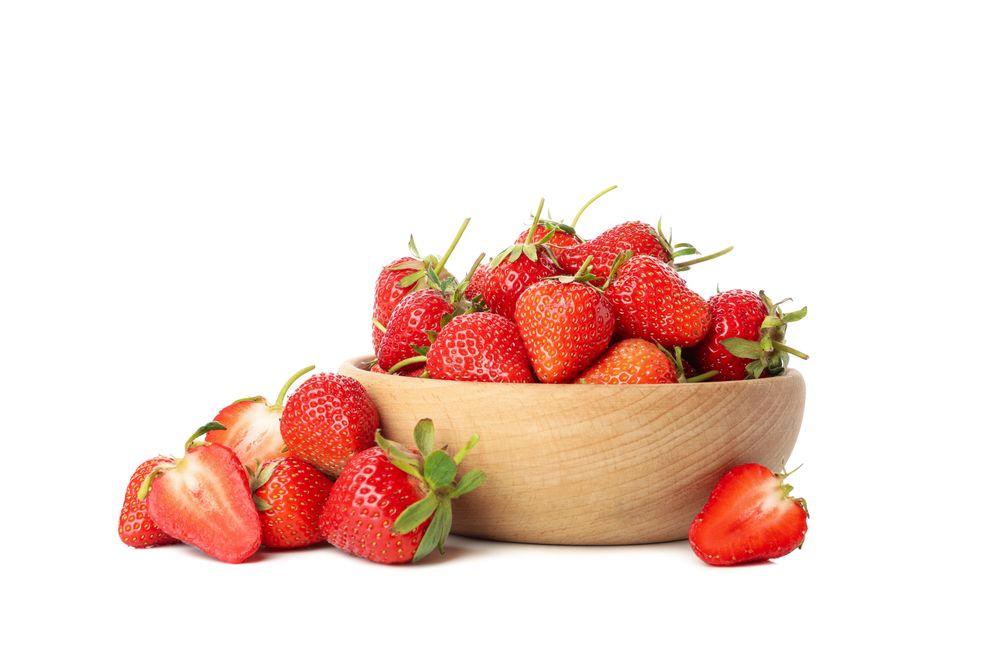 Bowl with tasty strawberry isolated on blank background. Summer berry