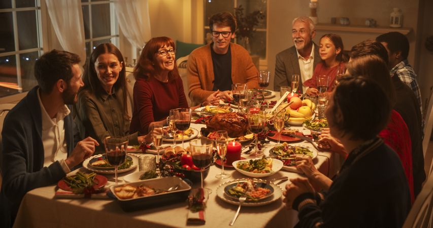 Family, Children, Friends and Young Couples Gather at Home for a Festive Christmas Evening.