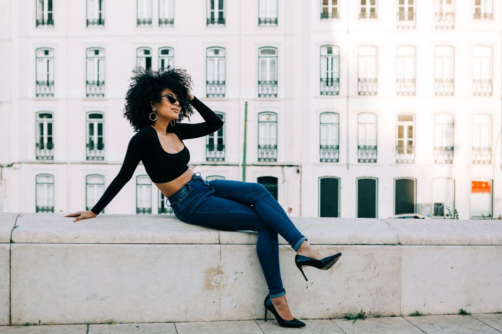 Fashionable female relaxing in city