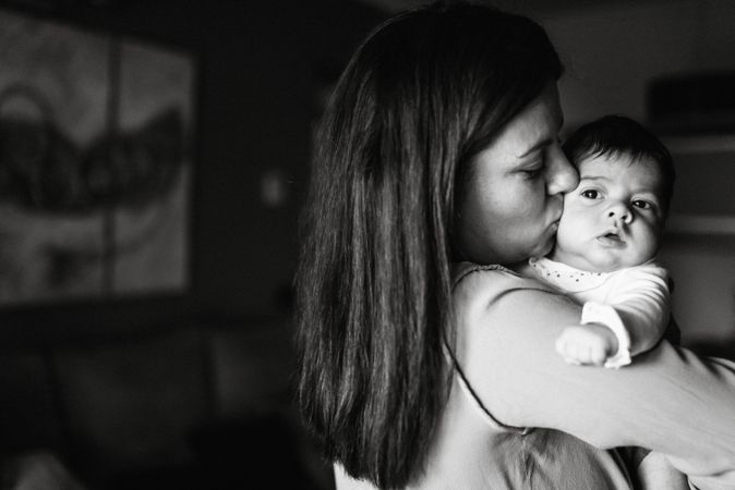 Mother holding baby in arms