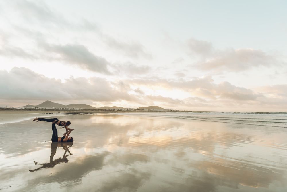 Women exercising near sea