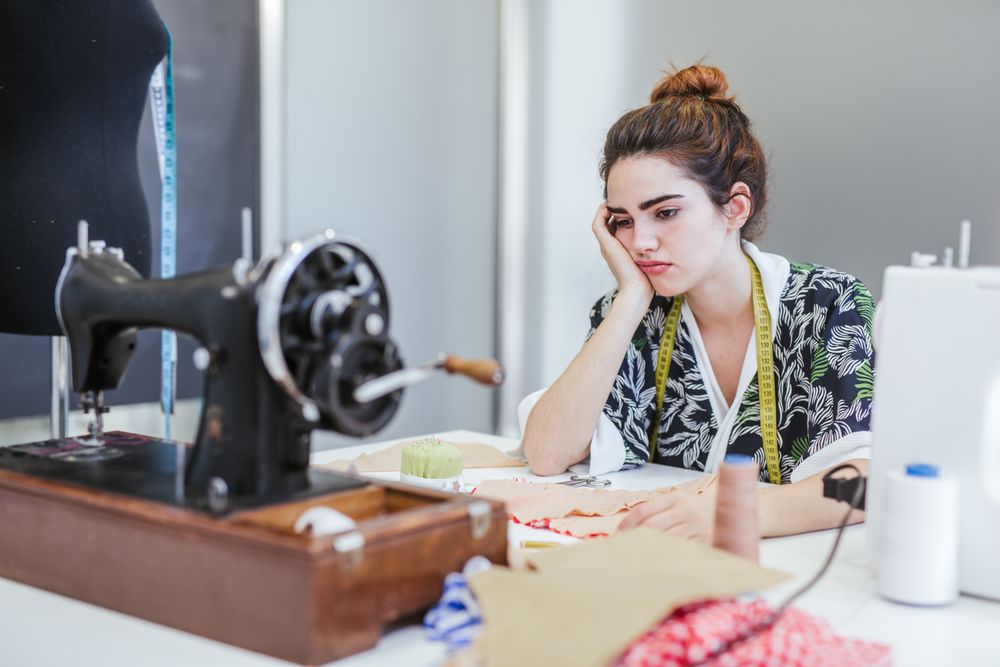 Woman in a sewing school