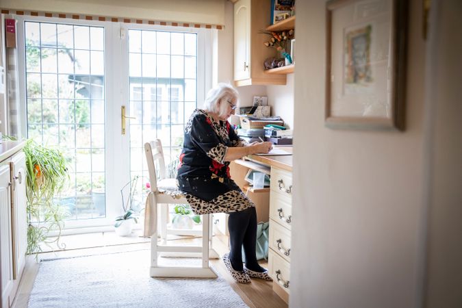 Woman writing at home
