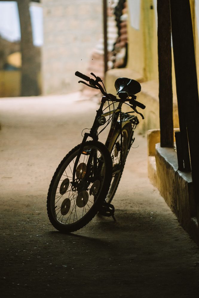 Bicycle parked on dark street