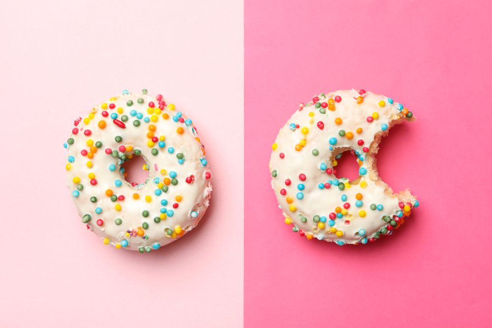 Two tasty donuts on two tone background