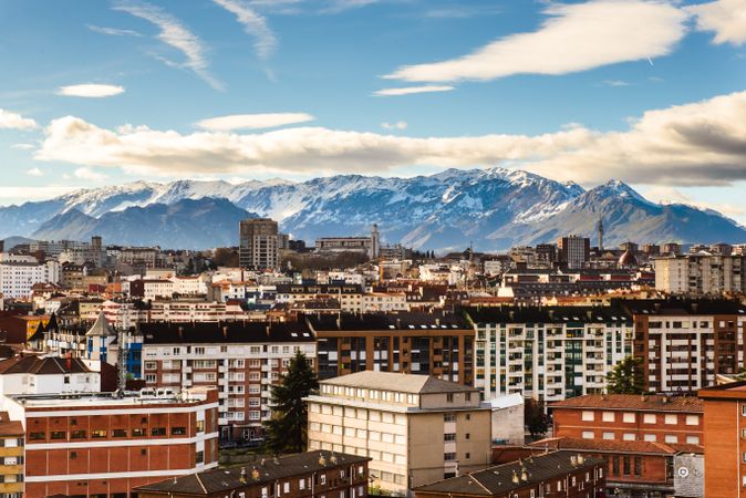 Modern buildings in city near mountains