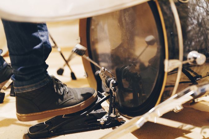 Man with headphones playing on drums