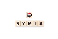 Wooden blocks bearing the name and flag of Syria.