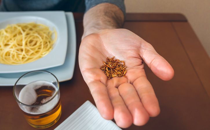 Man showing a handful of worms