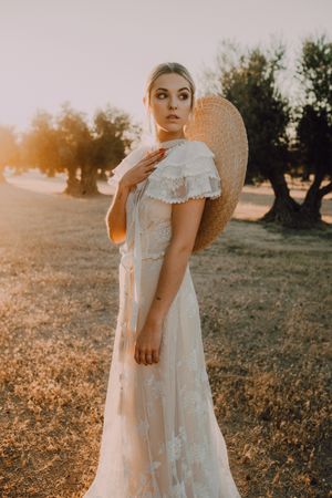 Woman in dress posing on nature