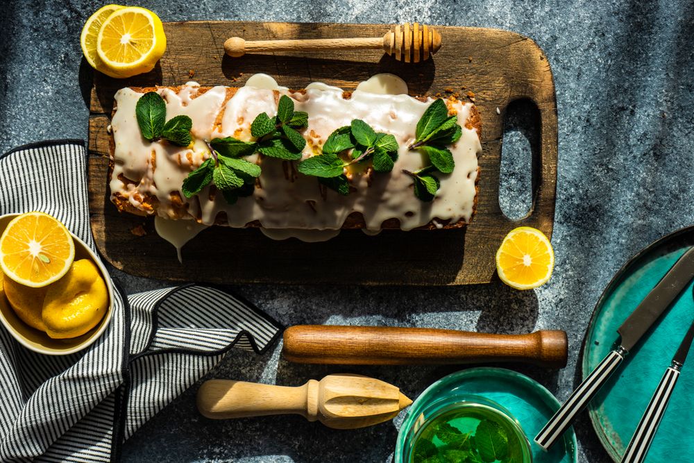 Freshly baked lemon cake with fresh mint garnish