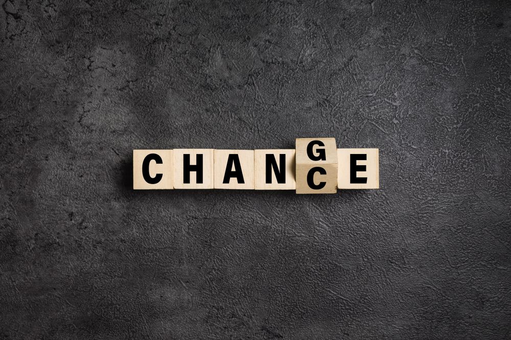 flip wooden blocks with change and chance words isolated on dark background