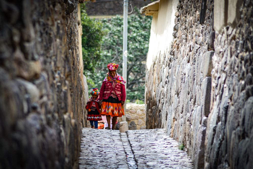Woman and child ascending stairs in the indigenous clothes of Uruguay