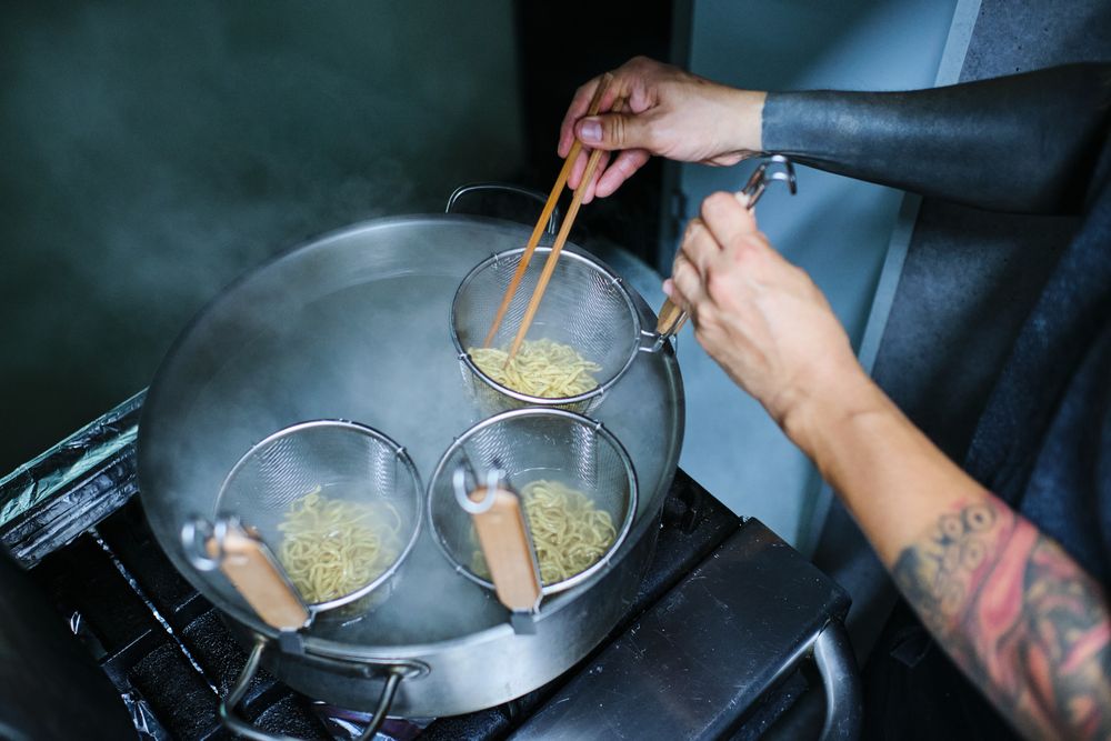 Chef Cooking in Japanese Restaurant