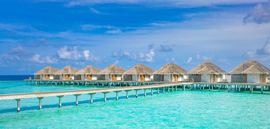 Walkway on the way to overwater bungalows in a resort, wide