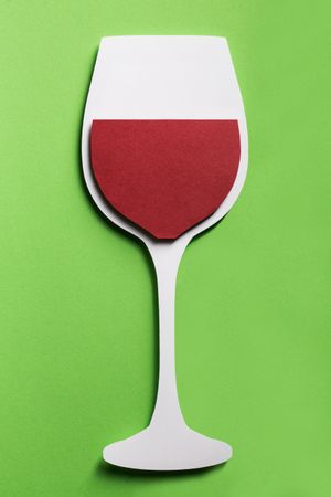 Silhouette of a glass of red wine made with cardboard