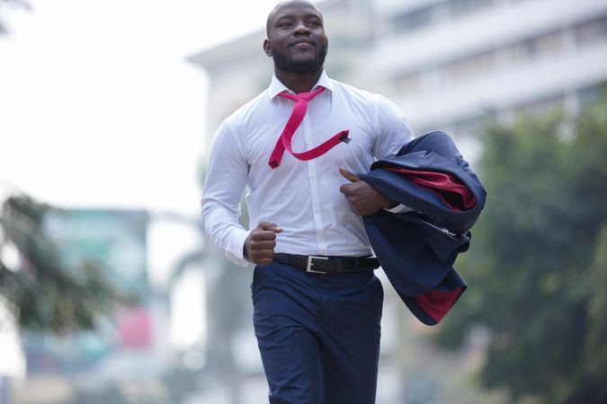 Man in suit walking outdoor