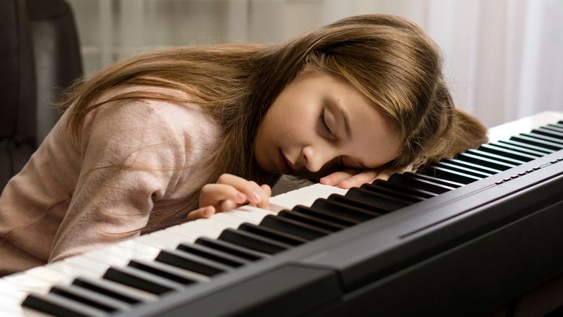 Tired Young Pianist Asleep
