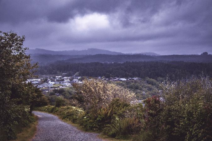 View of town from mountain trail on overcast day