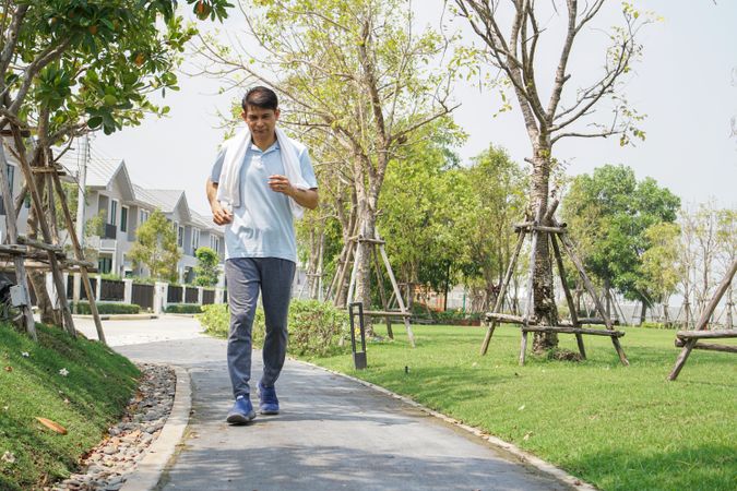 Male running outside on lane