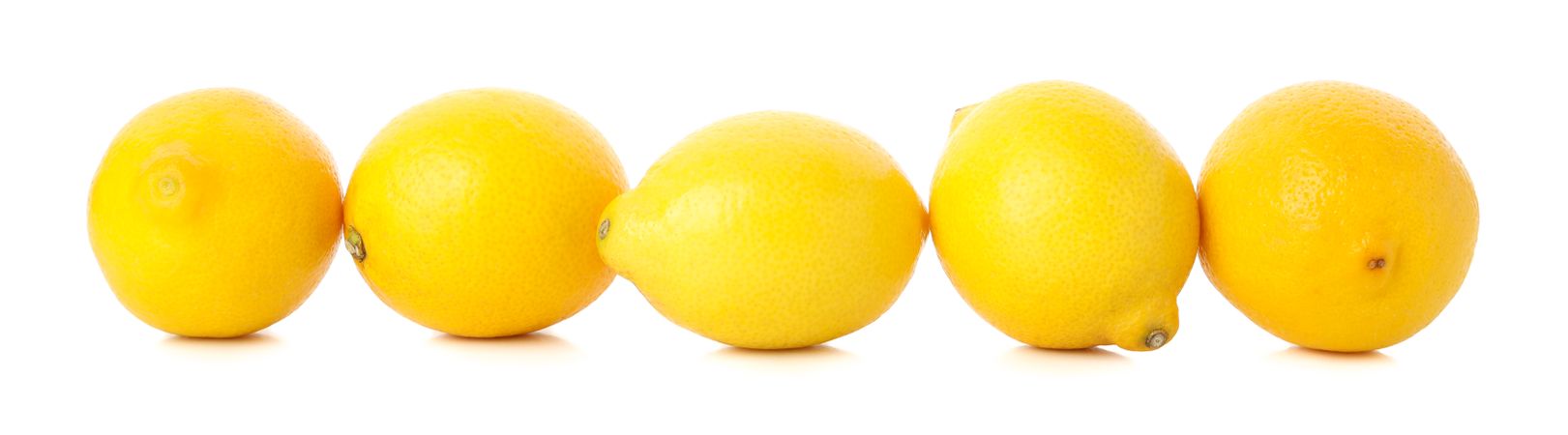 Fresh lemons isolated on light background. Ripe fruit