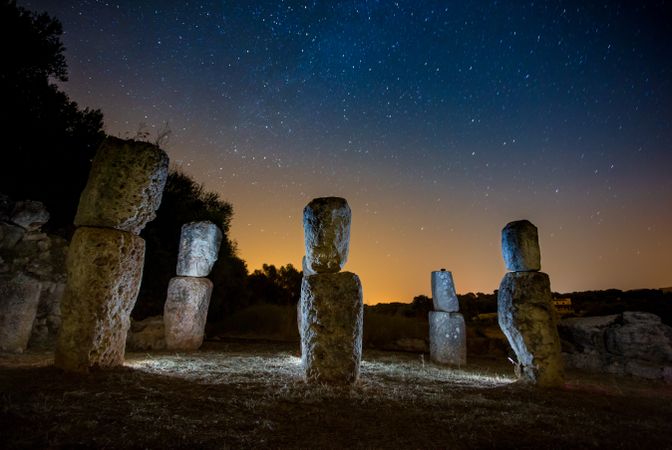 Stones illuminated by light at night
